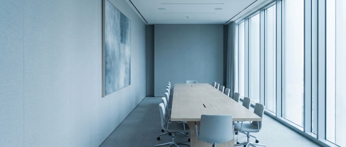 An empty boardroom with a long table, standing for a standards committee that has not yet been seated.